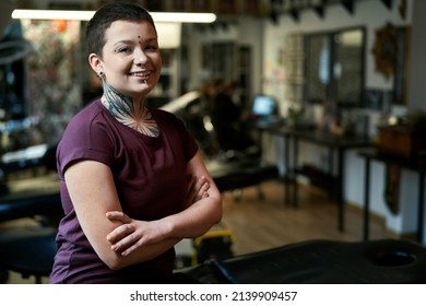 Portrait Of Caucasian Female Tattoo Artist In Tattoo Studio 