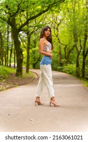 Portrait Of A Caucasian Girl On A Path In A City Park