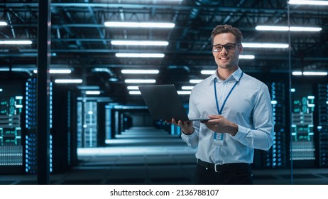 Portrait of Caucasian Male Specialist Using Laptop in Big Data Center. Managing Director Working Attentively. Technology Science Breakethrough. Progress and Innovation concept