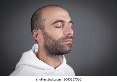 Portrait Of A Caucasian Man With Closed Eyes.