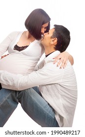 Portrait of Caucasian Man Together with Pregnant Wife Sitting Together Embraced Over White Background. Vertical Image - Shutterstock ID 1990489217