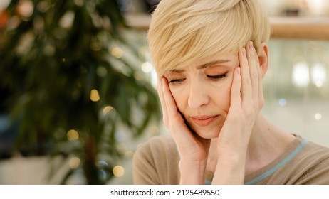Portrait caucasian middle-aged adult 40s woman tired lady exhausted stressed female holding head from bad problem headache painful migraine suffer divorce job loss bank debt ache pain health trouble