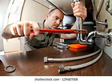portrait of caucasian plumber at work