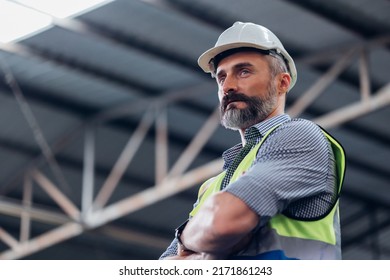 Portrait Caucasian professional Engineer factory. Engineering worker in safety hardhat at factory industrial facilities. Heavy Industry Manufacturing Factory - Powered by Shutterstock