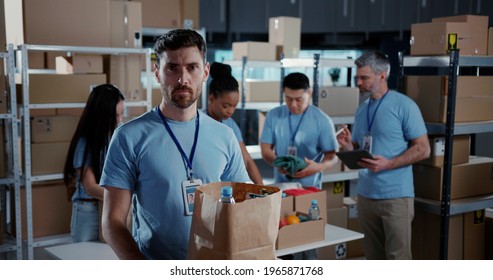 Portrait of caucasian volunteer worker colecting food suppy box for elderly people coworking helping others during coronavirus lockdown quarantine.