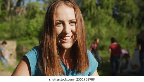 Portrait of a Caucasian woman with group of conservation volunteers cleaning up a river on a sunny day in the countryside, picking up rubbish. Ecology and social responsibility in a rural environment. - Powered by Shutterstock