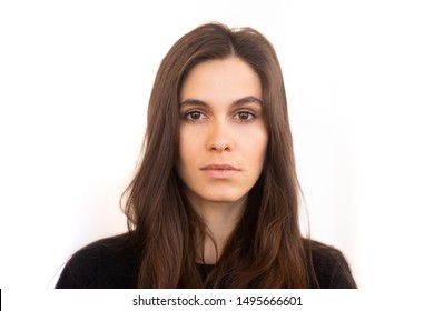 Portrait of caucasian woman with no expression. ID or passport photo full collection of diverse face and expressions. Calm interesting woman in black shirt with normal face expression
