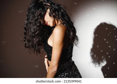 Portrait Of Caucasian Woman Salsa Dancer Under A Projector's Light