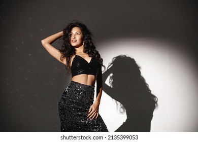 Portrait Of Caucasian Woman Salsa Dancer Under A Projector's Light