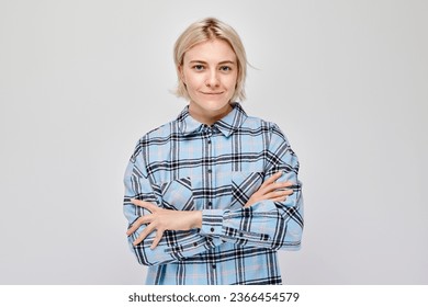 Portrait Caucasian young blond woman smiling joyfully isolated on white studio background. Happy girl in blue plaid shirt with glad face expression
 - Powered by Shutterstock