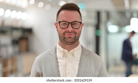 Portrait Of Caucasian Young Man Saying Yes By Shaking Head