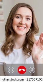 Portrait Of Caucasian Young Woman Making Video Calling With Smartphone At Home And Waving Hand. Smartphone Video Call Screen Design