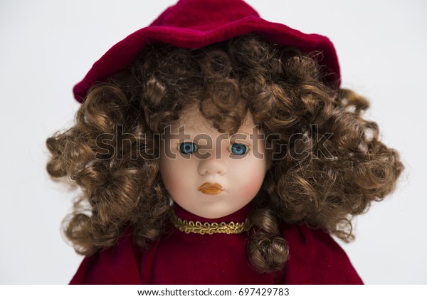 old doll with red hair