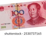 Portrait of the Chairman Mao Zedong (Mao Tse-Tung) (26 December 1893 – 9 September 1976). Chinese Plum (Prunus mume) flower. State emblem. Portrait from China 100 Yuan 2005 Banknotes.