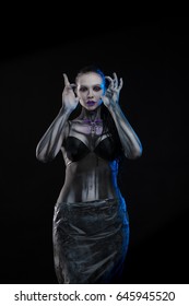 Portrait of a character for computer game
Body painting skeleton cyborg, woman with pattern on body on black background