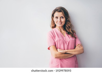 Portrait of charming beautician in pink lab coat looking at camera with smile.  - Shutterstock ID 1929978593