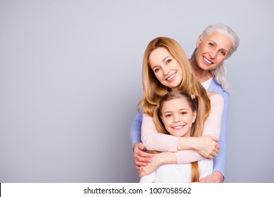 Portrait of charming beautiful friendly king supportive cute family members hugging each other isolated on gray background copyspace