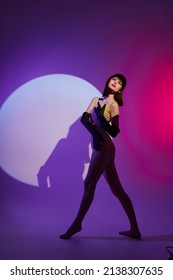 Portrait Of A Charming Lady Scene Spotlight Posing Neon Purple Background Unaltered