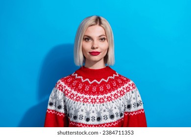 Portrait of charming lady wear warm woolen christmas jumper look in camera isolated blue color background