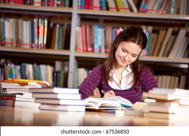 Portrait Of Charming Student Getting Ready For Report In College Library