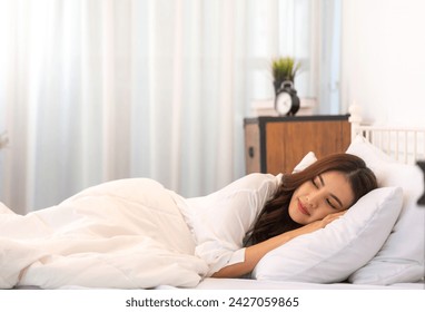 Portrait of cheerful beautiful pretty asian woman clean fresh healthy white skin sleeping and close eye.Girl felling relaxing and enjoy time on the bed at home.asia beauty - Powered by Shutterstock