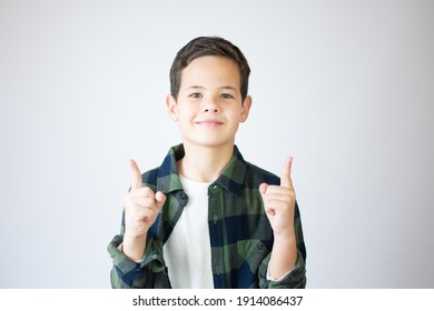 Portrait Of Cheerful Boy With Good Idea - Isolated Over White Background. 10 Year Old Kid Pointing Finger Up. Child Points By Finger Upward. Cheerful Boy Shows Something