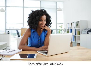 Portrait Of Cheerful Business African-American Lady Working On Laptop