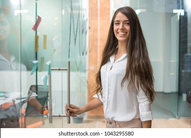 Portrait Of Cheerful Business Woman Entering Meeting Room.