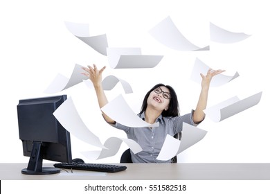 Portrait Of Cheerful Businesswoman Looking Paper Flying Over Her Head, Isolated On White Background 