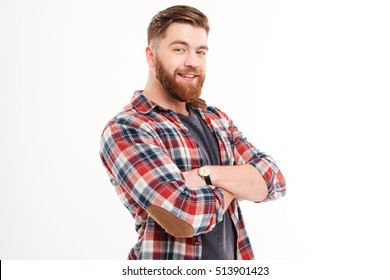 Portrait of a cheerful casual man in plaid shirt with arms folded looking at camera isolated on a white background - Powered by Shutterstock