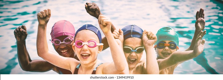 Portrait of cheerful children enjoying at poolside - Powered by Shutterstock