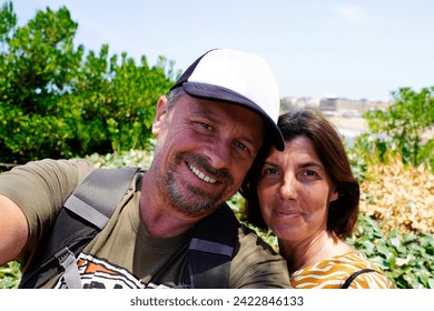 Portrait of cheerful couple middle aged in selfie picture by cell phone - Powered by Shutterstock