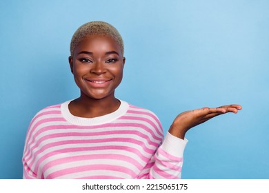 Portrait Of Cheerful Cute Sweet Lady Hand Arm Palm Demonstrate Empty Space Discount Shopping Low Price Isolated On Blue Color Background