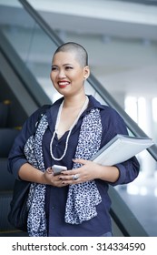 Portrait Of Cheerful Elegant Business Woman With Shaved Hair