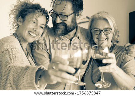 Elderly and middle-aged women enjoying wine outdoors