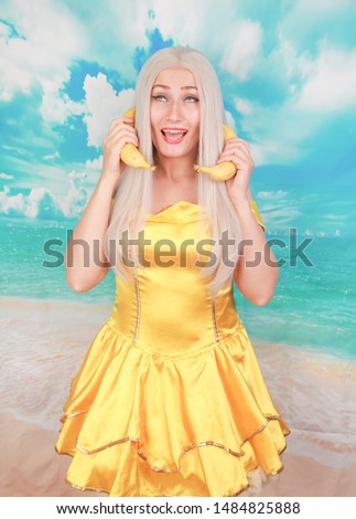 Portrait of cheerful funky playful lady holding banana like phone
