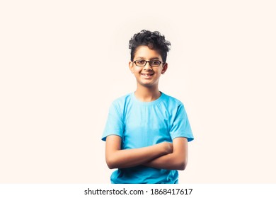 Portrait Of Cheerful Indian Asian Little Boy With Spectacles Celebrating Success Standing Against White Background