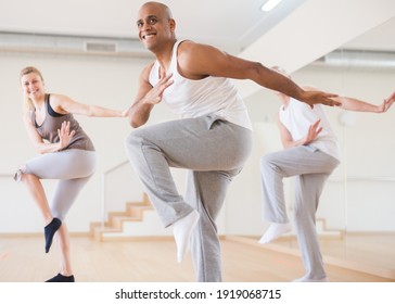 Portrait Of Cheerful Male Dancer During Group Dance Workout In Fitness Center