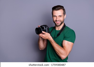 Portrait of cheerful man paparazzi hold dslr camera have spring free time holiday wear good look copyspace outfit isolated over grey color background - Powered by Shutterstock