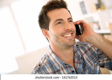 Portrait Of Cheerful Man Talking On The Phone