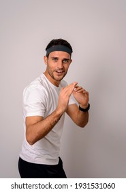 Portrait Of A Cheerful Man In A White T-shirt Pretending To Be A Funny Karate Teacher