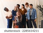 Portrait of cheerful mixed age range multi ethnic women celebrating International Women
