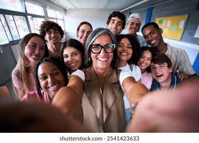 Portrait of cheerful multiracial group of students friends taking selfie with female teacher in class. Concept of Generation z people friendship posing with happy expression looking smiling at camera - Powered by Shutterstock