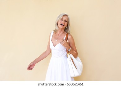 Portrait Of Cheerful Older Woman In Summer Dress