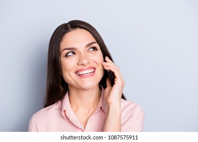 Portrait of cheerful, positive, glad, charming, pretty, brunette woman having funny, comic conversation on smart phone, cellphone, enjoying talking with friend, isolated on grey background - Shutterstock ID 1087575911