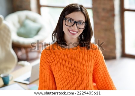 Portrait of cheerful pretty lady specialist director company wear spectacles orange bright sweater working modern office workplace indoors