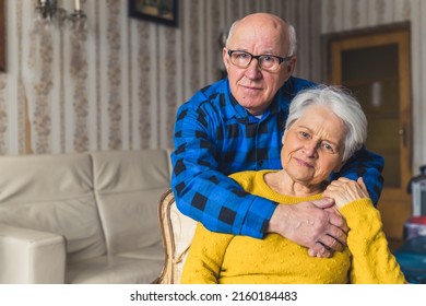 Portrait Of A Cheerful Senior Caucasian Couple Embracing In The Living Room Medium Closeup Senior People Love Concept. High Quality Photo