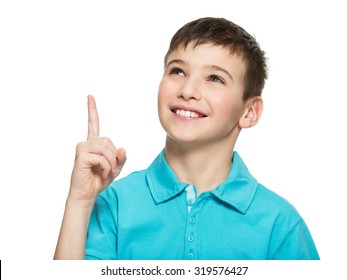 Portrait Of The Cheerful Teen Boy Pointing Finger Up -  Isolated Over White Background