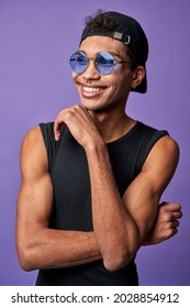 Portrait Of Cheerful Transgender Male In Black T-shirt, Blue Sunglasses. Latin American Trans Gender