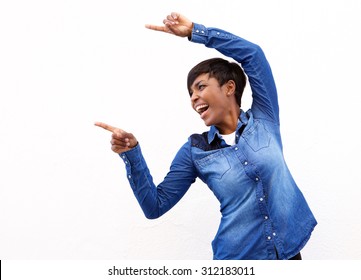 Portrait Of A Cheerful Young African American Woman Pointing Fingers